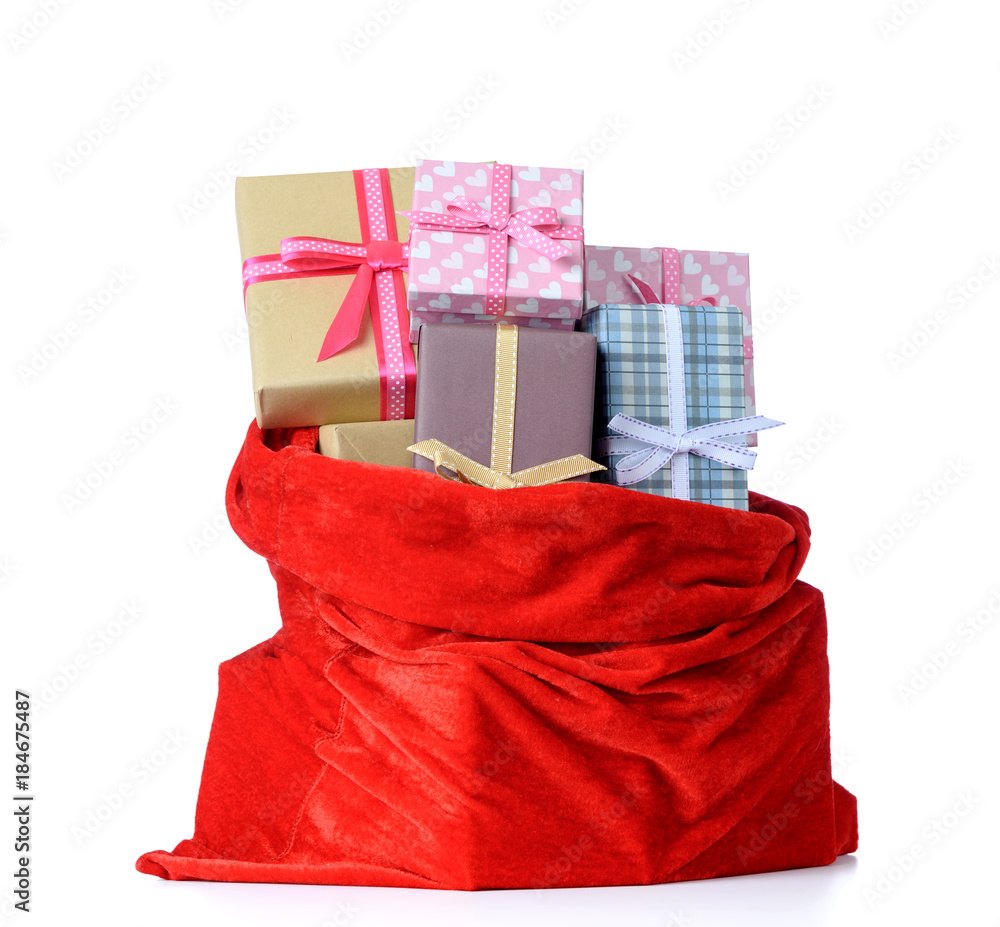 Santa Claus red bag full of Christmas boxes with gifts on white ...