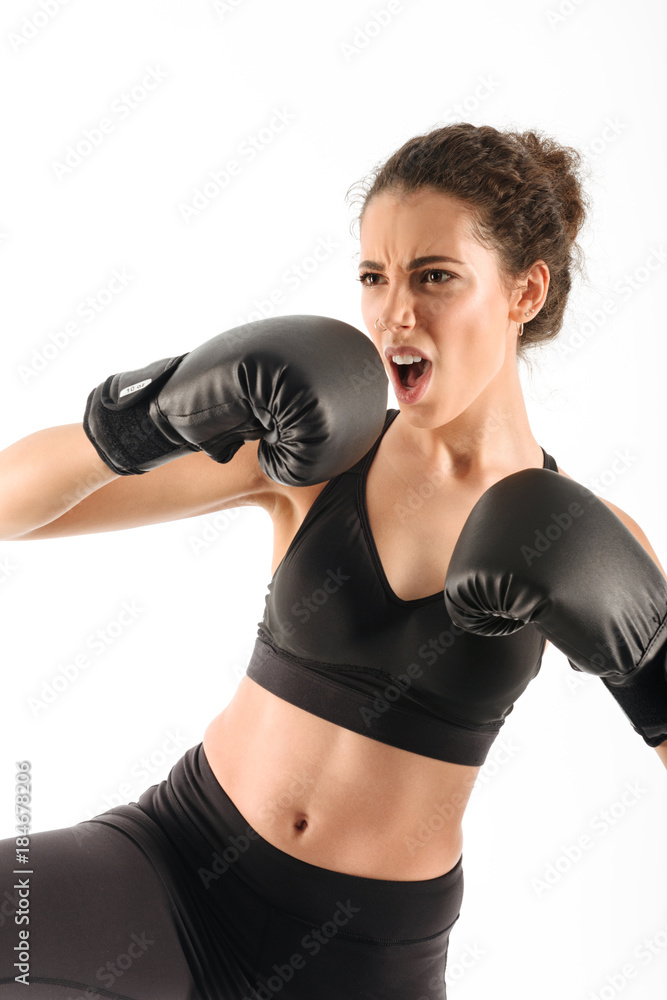 Vertical image of cool screaming curly brunette fitness woman