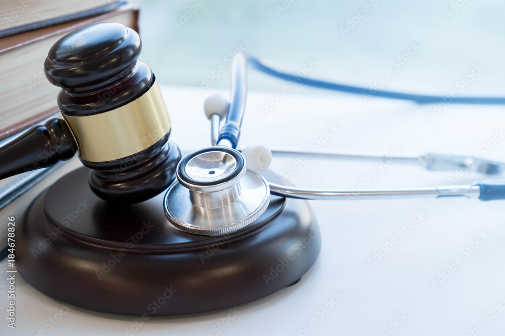 Gavel and stethoscope. medical jurisprudence. legal definition of medical malpractice. attorney. common errors doctors, nurses and hospitals make Gavel and stethoscope. medical jurisprudence. legal definition of medical malpractice. attorney. common errors doctors, nurses and hospitals make