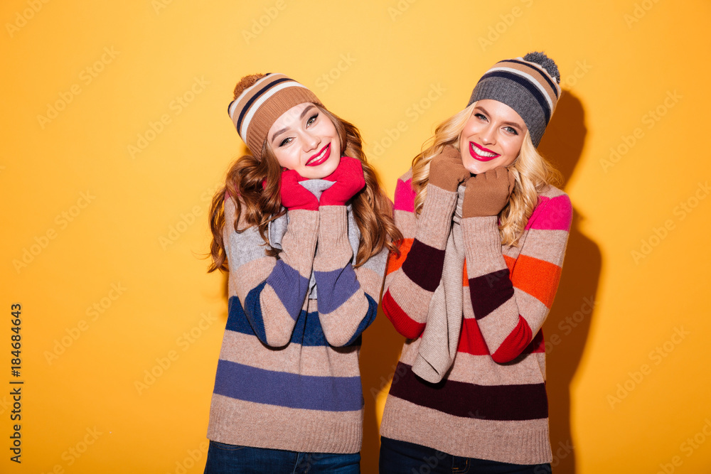 Portrait of two lovely girls dressed in winter clothes Portrait of two lovely girls dressed in winter clothes