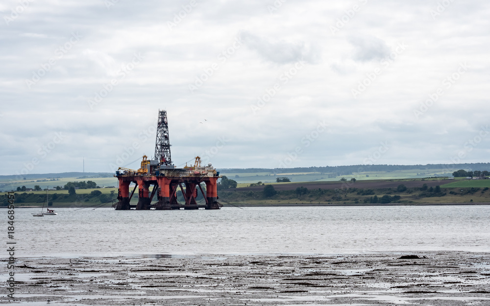 Oil Rig, Cromarty Firth, Scotland. An oil rig off the Scottish north east coast undergoing routine maintenance before going back out to drill.