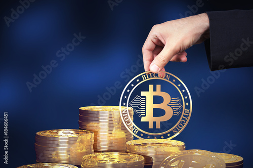 Virtual cryptocurrency concept with golden coins of bitcoin