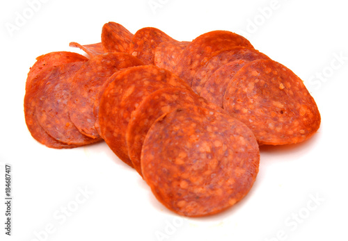 Konstfotografi Slices of pepperoni on white background