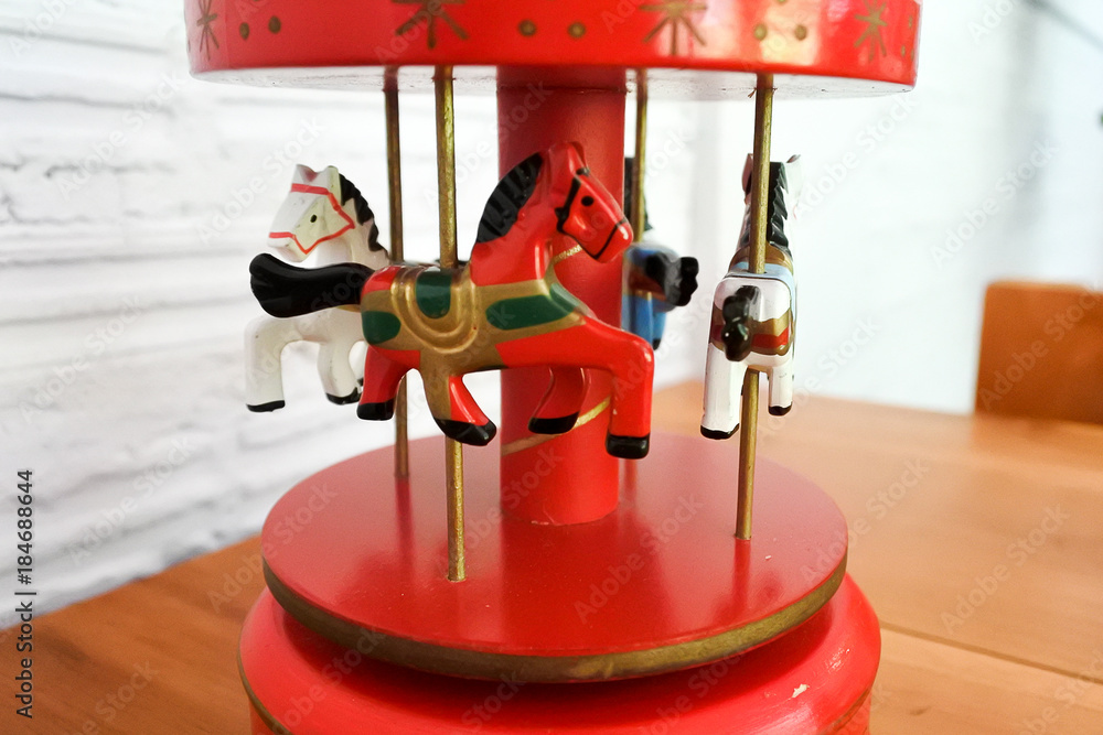 Fotka „Carousel music box, The music makes us think of childhood as having  fun. Many children will remember those good memories through this vintage  small toys.“ ze služby Stock | Adobe Stock