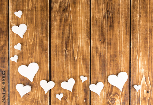 hearts frame on a wooden background