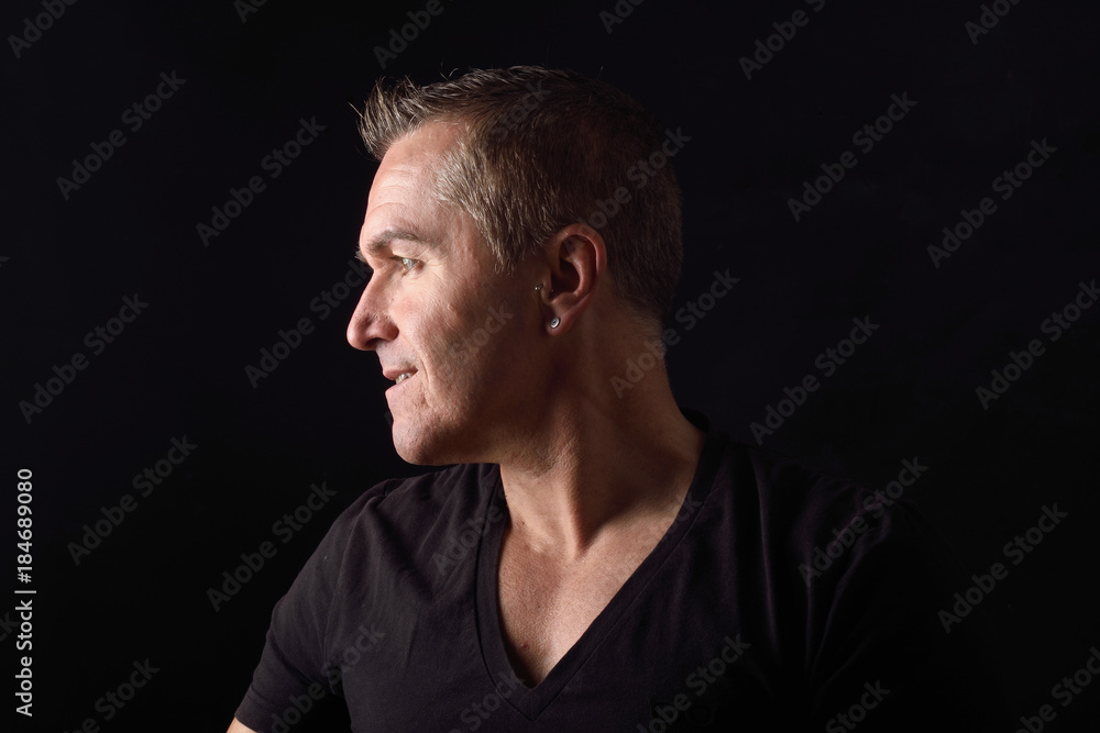 portrait of a man on black background