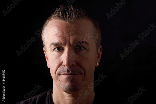 portrait of a man on black background