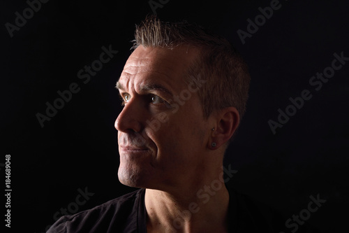 portrait of a man on black background