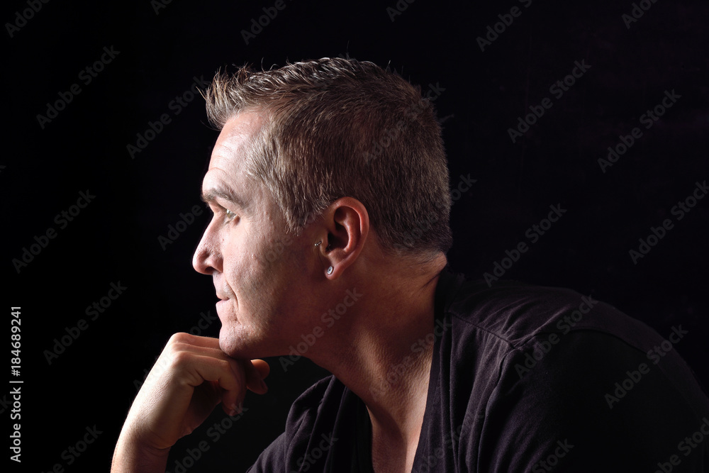 portrait of a man on black background