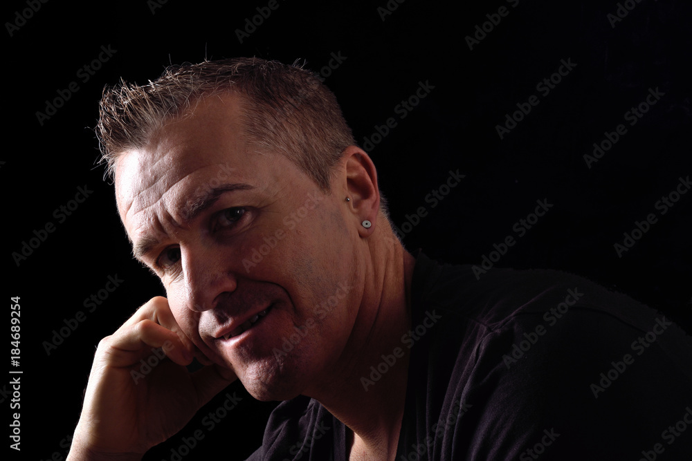 portrait of a man on black background portrait of a man on black background