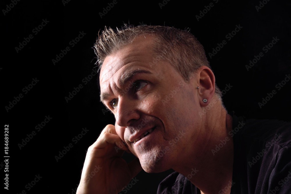 portrait of a man on black background portrait of a man on black background