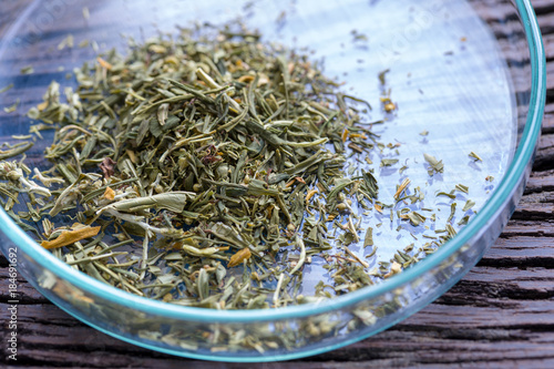 Powder of Cannabis  Drugs  on the background wood.