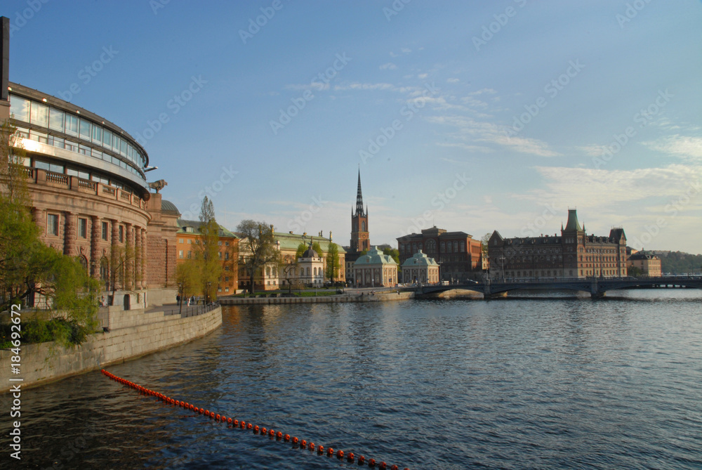 Riksdagshuset (parliament) and  Riddarholmskyrkan church in Stockholm in the evening