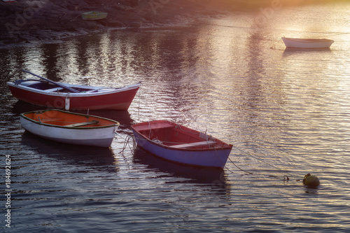 Boats on water. Small lake in Arrecife. Lanzarote, Canary island. Sunset time with a glamour glow light