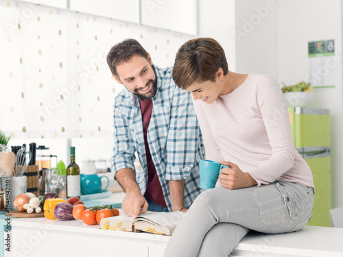 Couple searching recipes on the cookbook