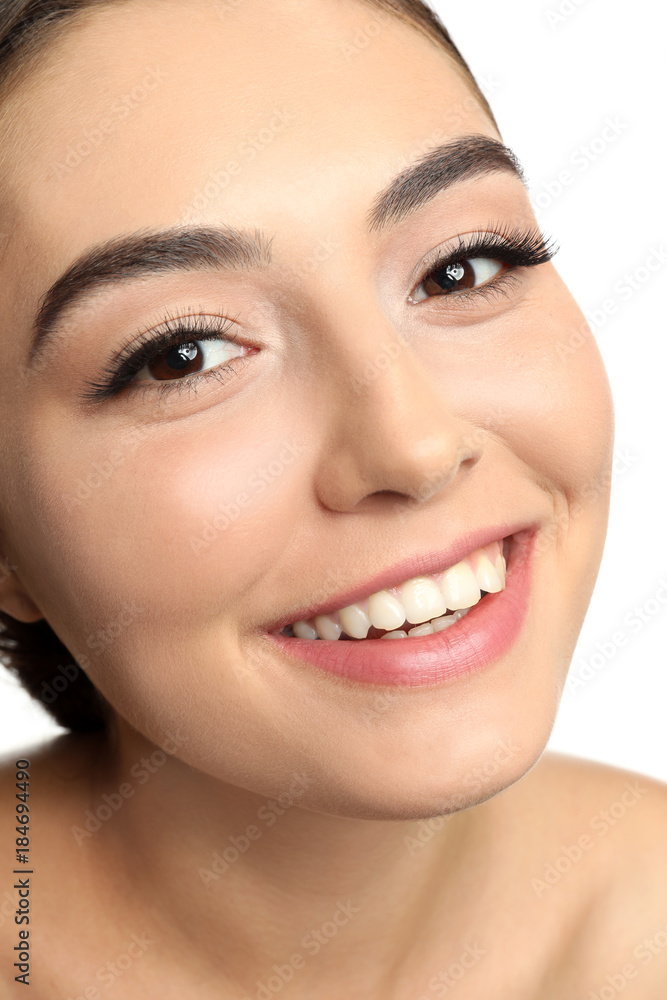 Portrait of beautiful young woman with eyelash extensions on white background Portrait of beautiful young woman with eyelash extensions on white background