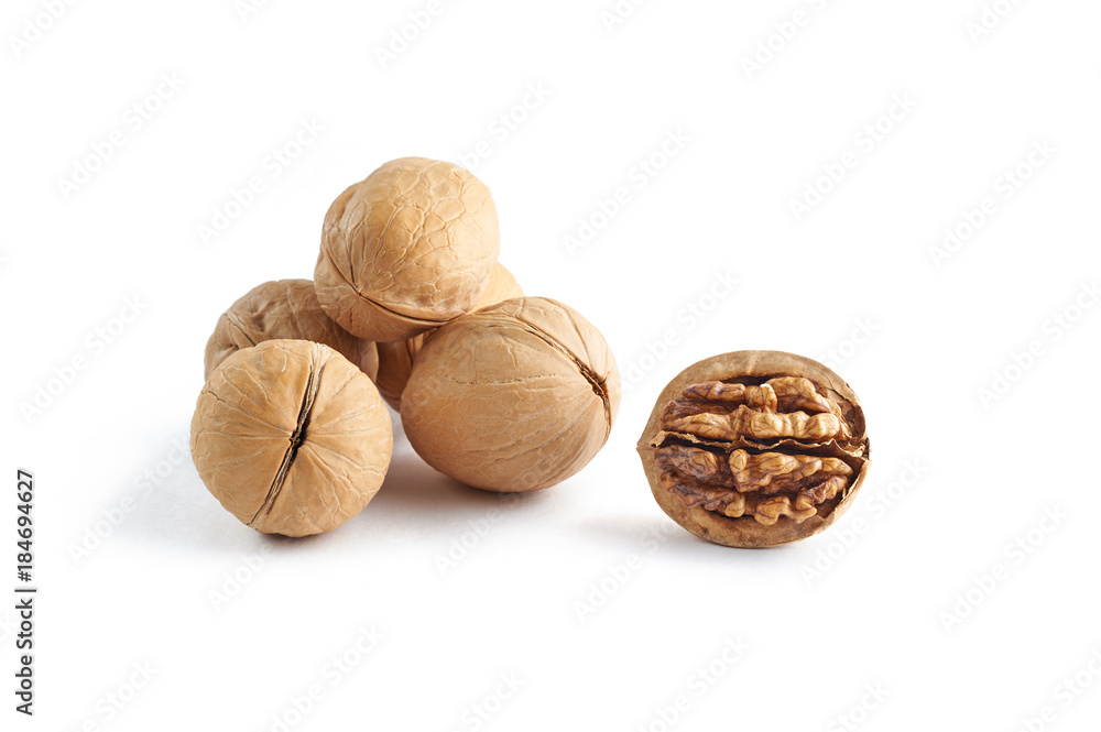 Walnuts and walnuts kernels isolated on white background Walnuts and walnuts kernels isolated on white background