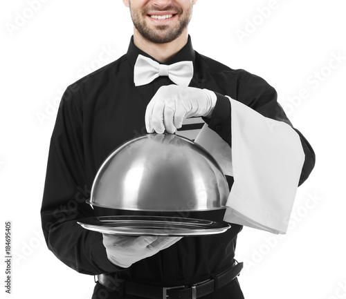 Waiter with metal tray and ...