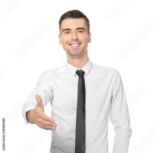 Attractive young man in formal wear on white background