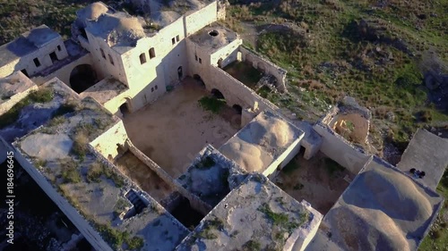 Aerial view of Ottoman era fortress ruins on top of mediterranean hill | 4k UHD