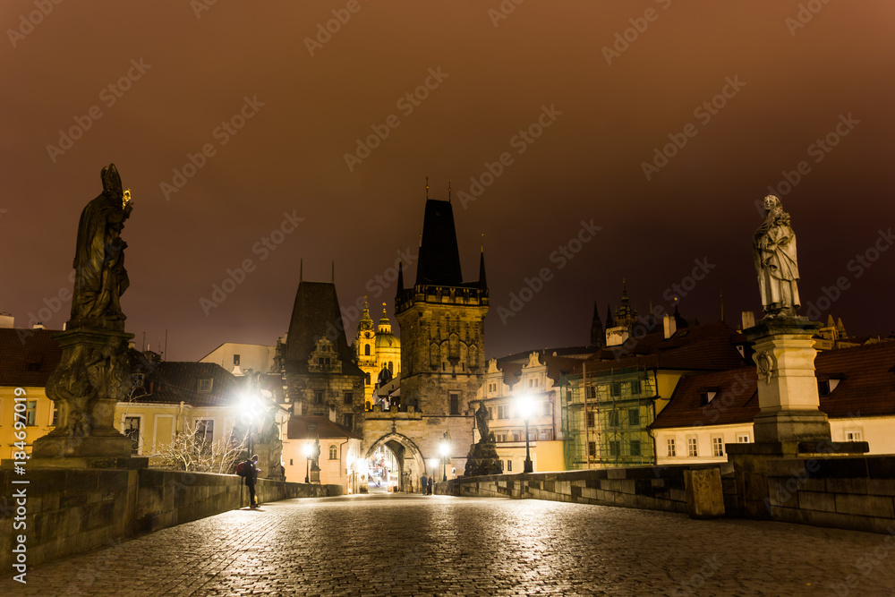 Charles bridge in Prague with lanterns at night