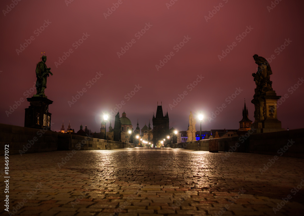 Obraz premium Charles bridge in Prague with lanterns at night