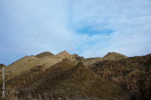 multicolored hills of the quarry for the extraction of manganese ore