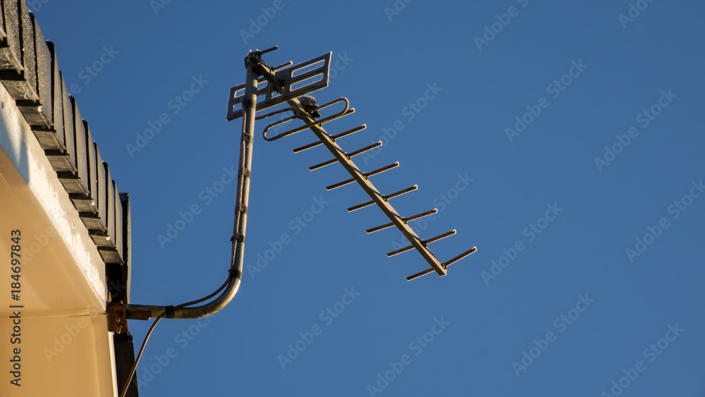 Television aerial on the gable end of a roof. Television aerial on the gable end of a roof.