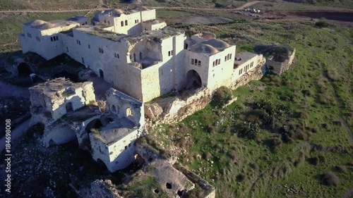 Aerial view of Ottoman era fortress ruins on top of mediterranean hill | 4k UHD