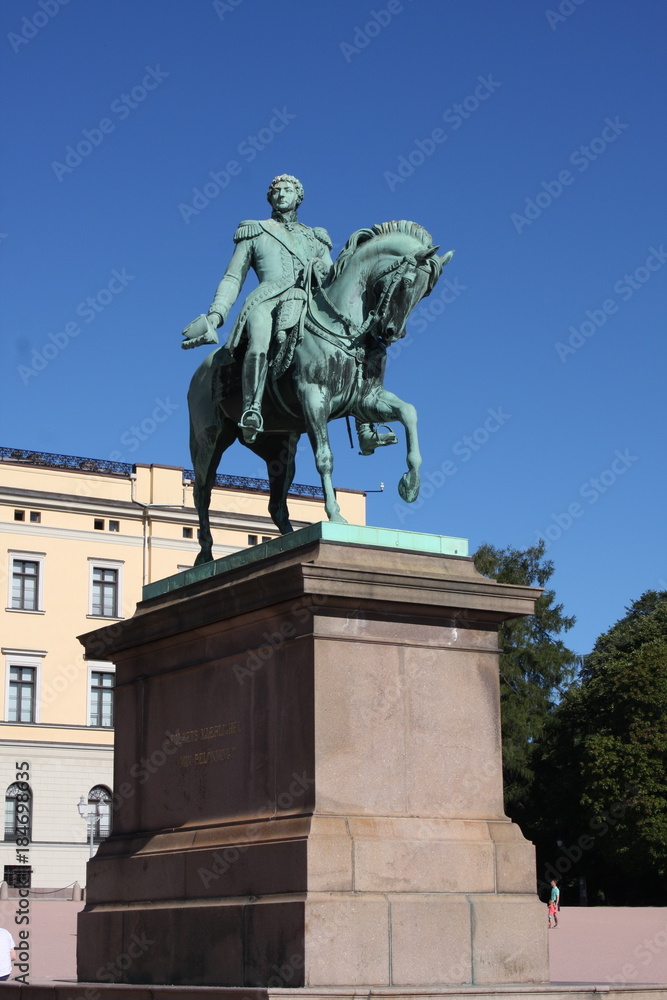 Equestrian statue of Karl XIV Johan in Oslo in winter, Norway. The statue was erected in 1875. The motto on pedestal reads: The love of the people is my reward.