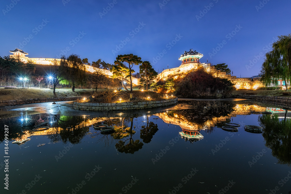 Reflection of Suwon Hwaseong fortres at night in Suwon.Korea