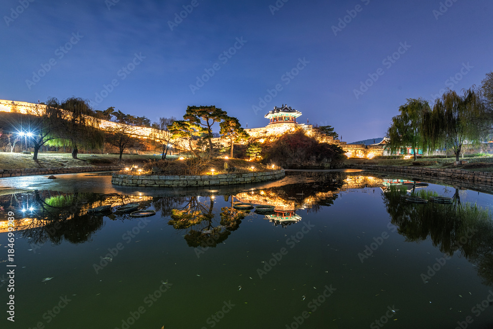 Reflection of Suwon Hwaseong fortres at night in Suwon.Korea