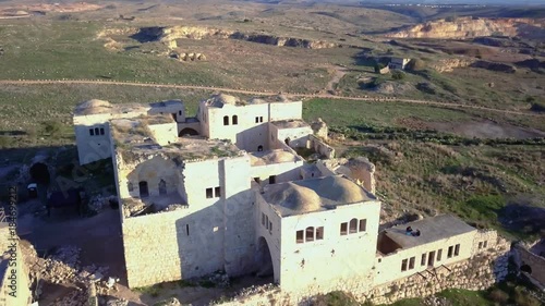 Aerial view of Ottoman era fortress ruins on top of mediterranean hill | 4k UHD