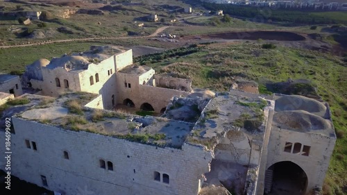 Aerial view of Ottoman era fortress ruins on top of mediterranean hill | 4k UHD