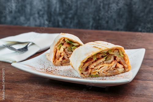 Roll with chicken and vegetables. Shawarma. Fast food