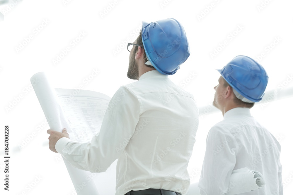 rear view.architect and Builder looking at blank screen rear view.architect and Builder looking at blank screen