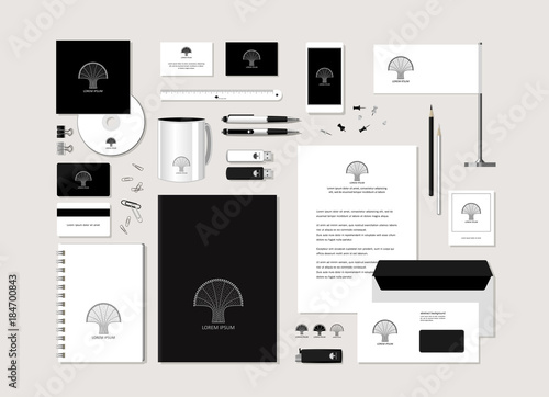 The neutral black-and-white corporate identity with the stylized tree.