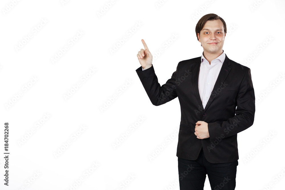 Portrait of young business man pointing to copy space isolated on white background. Portrait of young business man pointing to copy space isolated on white background.