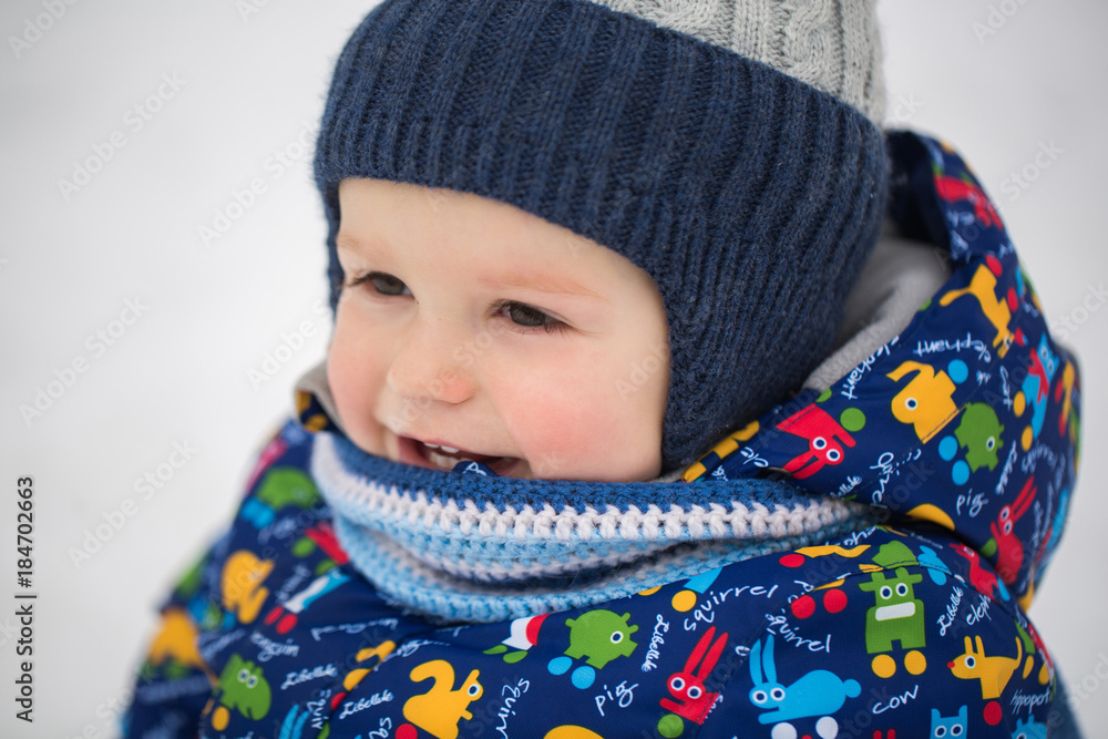 Small boy in winter snow.