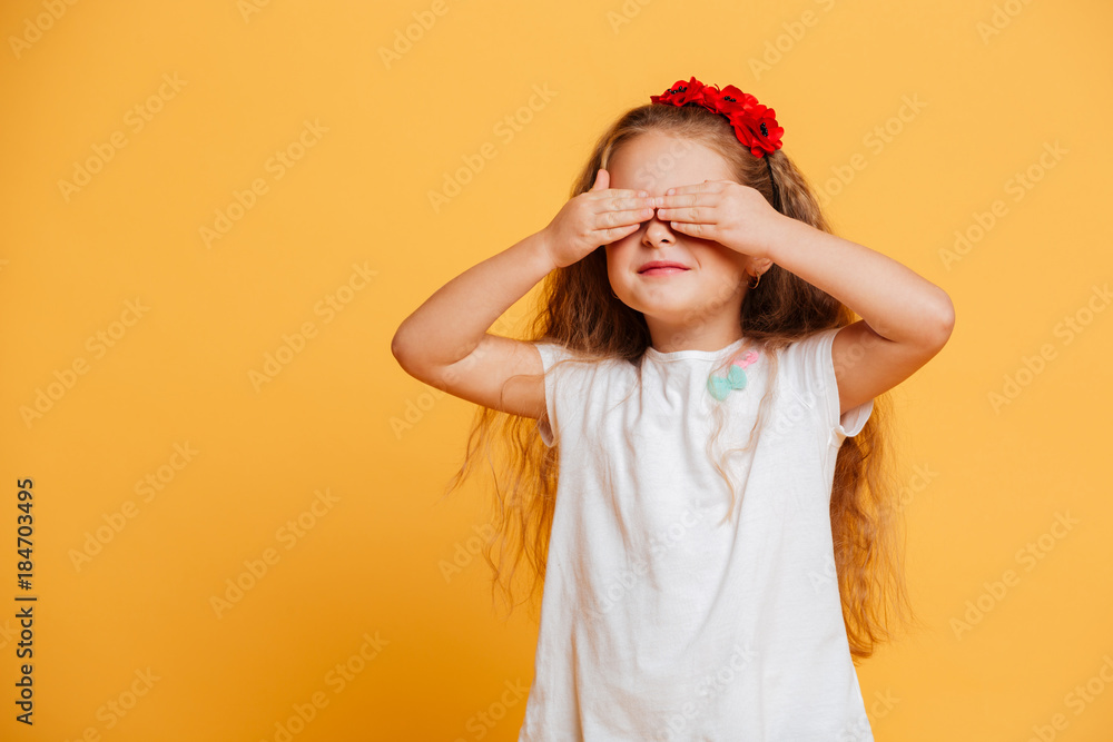 Little girl child standing isolated over yellow Little girl child standing isolated over yellow