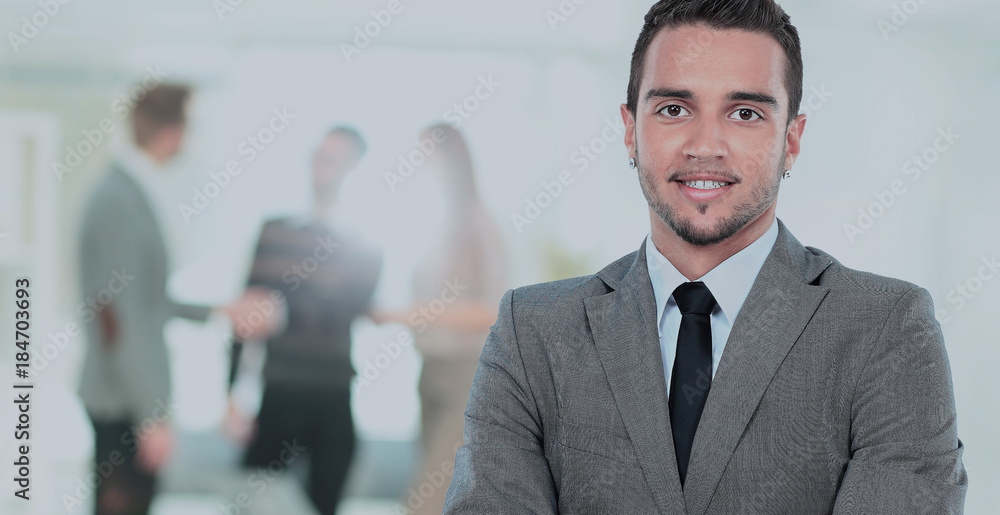 Happy mature business man looking at camera with satisfaction at office Happy mature business man looking at camera with satisfaction at office