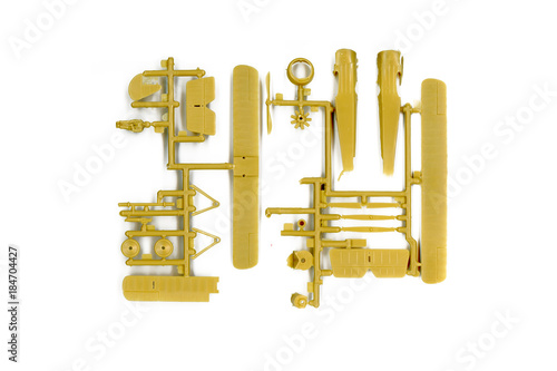 An unassembled plastic model kit of a vintage triplane airplane