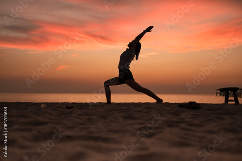 Yoga in the sunset beach