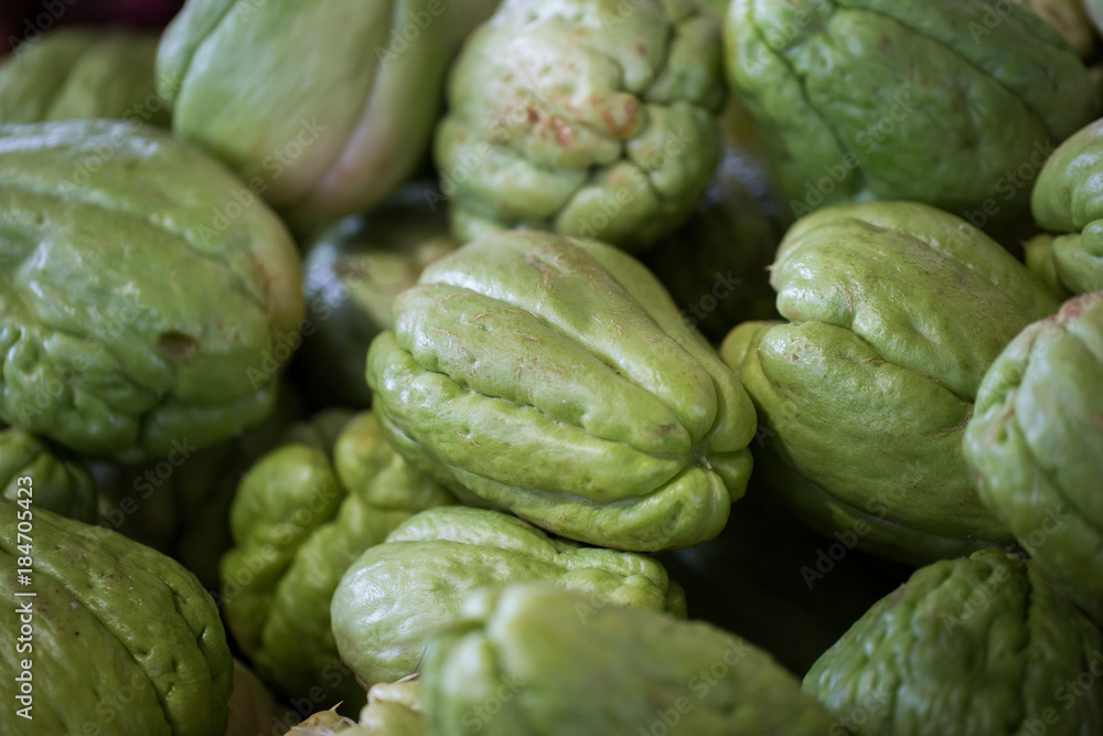 Fototapeta premium Fresh vegetables Chayote. Chuchu in the Indian market in Mauritius.