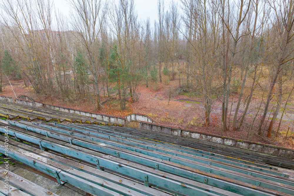 Overgrown stadium in ghost city Pripyat.