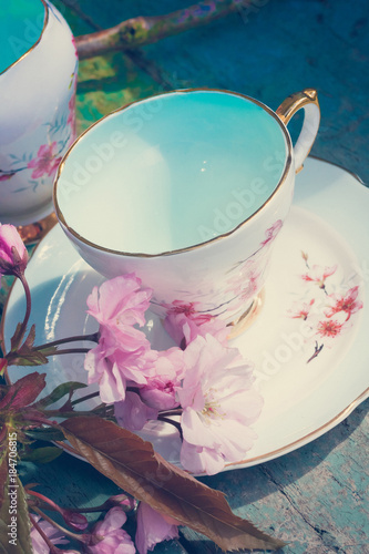 Beautiful, English, vintage teacup with Japanese cherry tree blossoms, close up photo