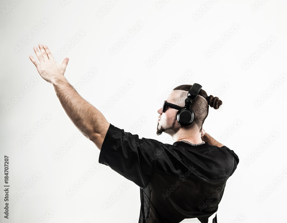 creative rapper in the headphones and dark glasses performs a ra creative rapper in the headphones and dark glasses performs a ra