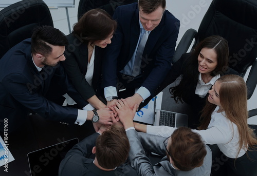 Business people showing unity with their hands together