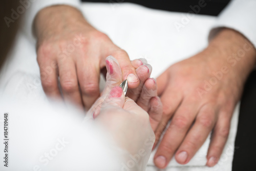 Close-up Of A Manicurist Cutting Off The Cuticle From The Person s Fingers