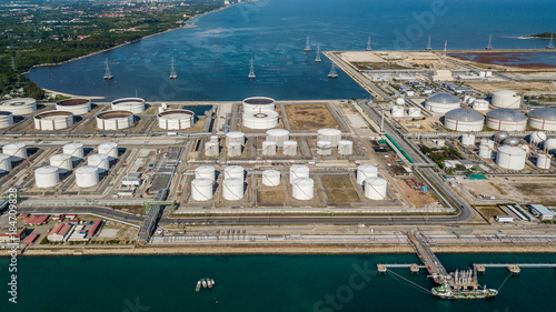 Aerial view oil terminal is industrial facility for storage of oil and petrochemical products ready for transport to further storage facilities. photo